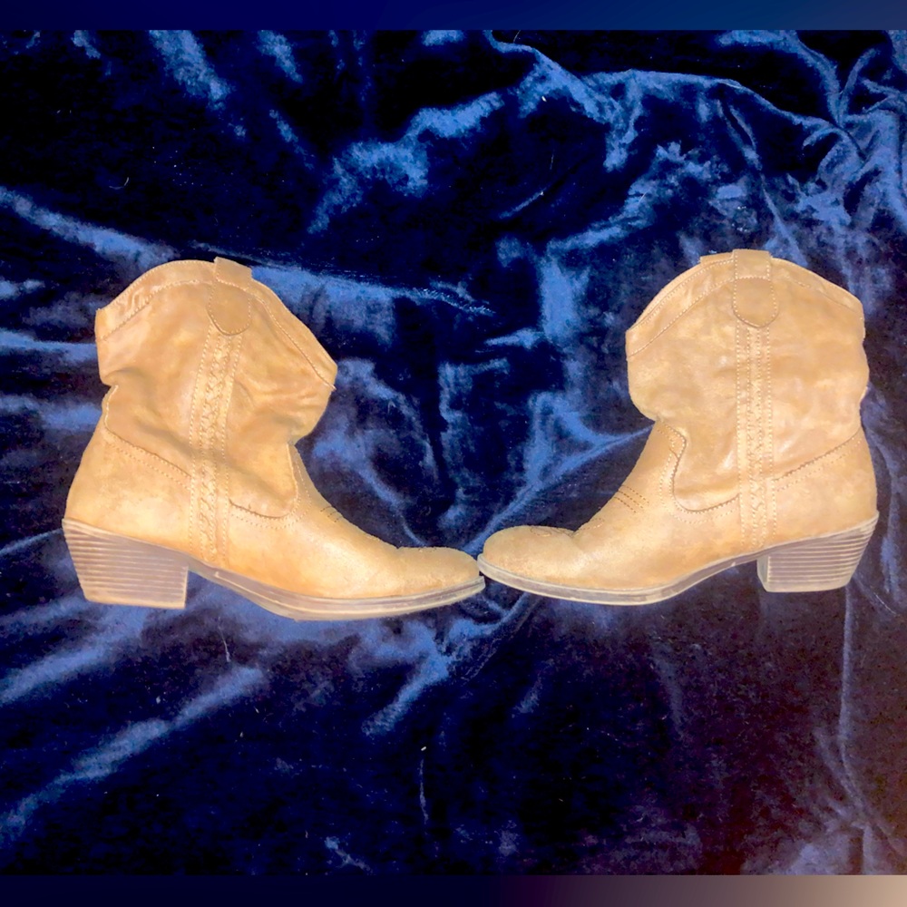 Brown ankle heeled booties.
